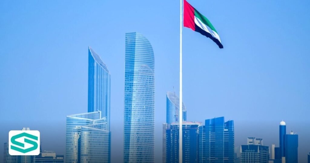 How to Sponsor Family on a UAE Freezone Visa - modern skyline of cityscape with national flag waving against clear sky