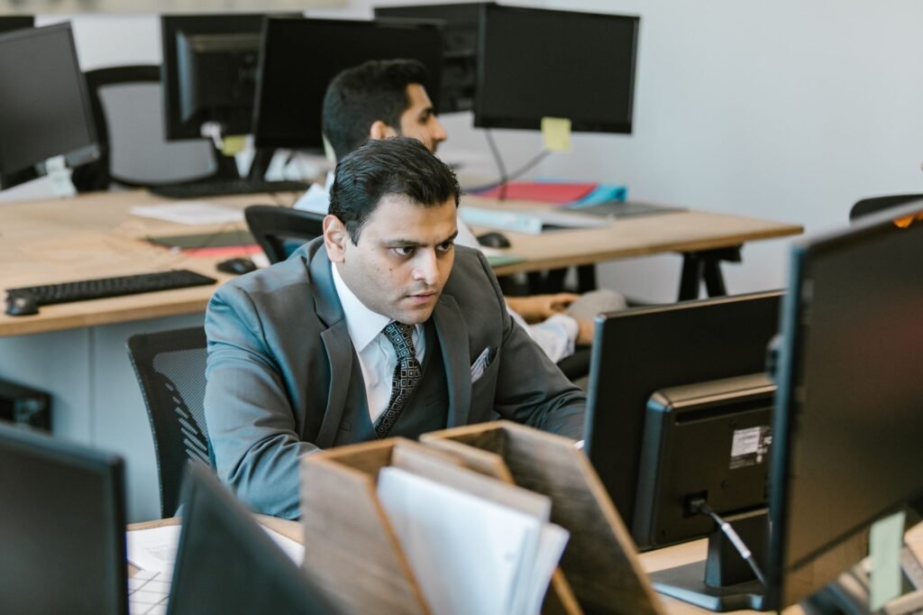 Egyptian entrepreneur reviewing UAE free zone business licence documents at a modern office