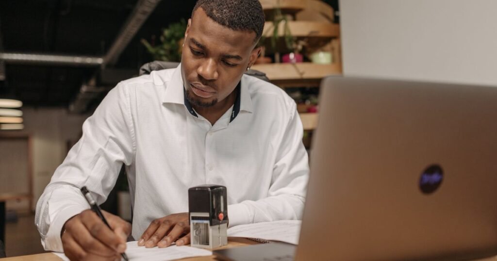 Sri Lankan business professional setting up a UAE free zone company in 2026 — reviewing documents and company formation paperwork