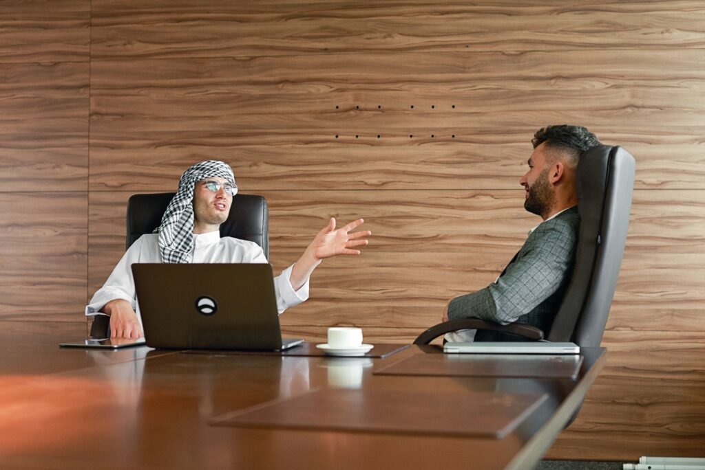 UAE free zone company setup for Bahraini nationals - business professionals in office meeting 2026