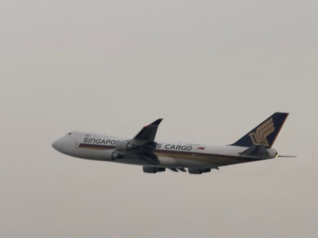 Singapore Airlines Cargo freighter on stand at Sharjah International Airport beside SAIF Zone