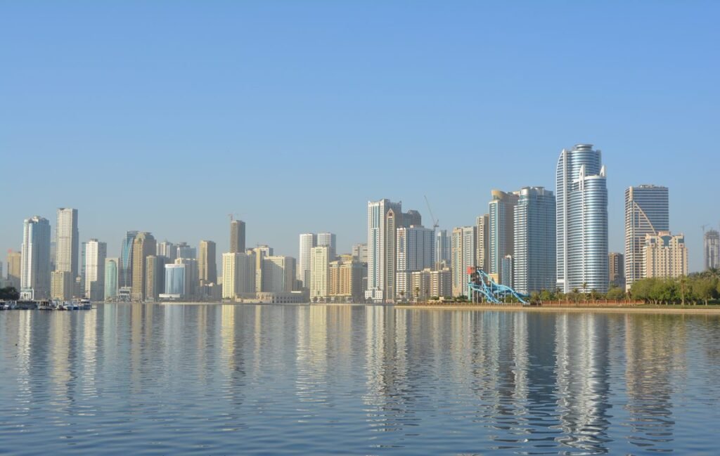 SHAMS free zone company setup - Sharjah city skyline where Sharjah Media City companies are licensed