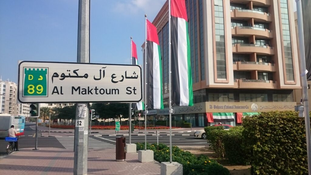 Road sign on Al Maktoum Street in Dubai, where residents complete a UAE driving licence transfer at RTA centres