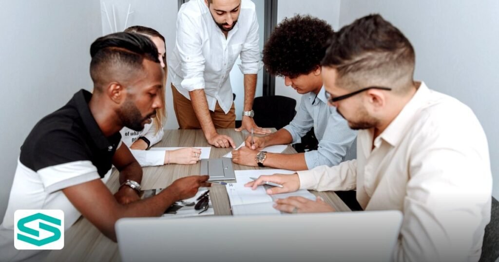 Can a Foreigner Own a Business in UAE? A 2026 Guide - a diverse group of professionals actively collaborating at an office