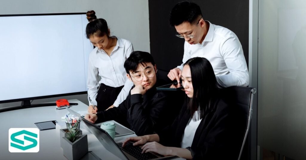 Setting Up a UAE Free Zone Digital Marketing Agency in 2026 - a team of professionals discussing and collaborating around