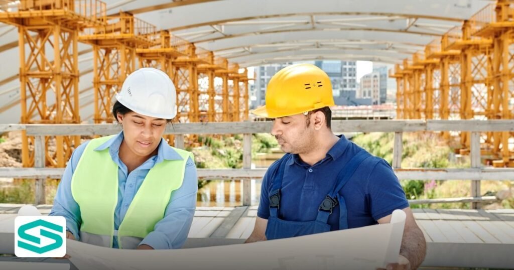 Green Construction Abu Dhabi Free Zone: 2026 Setup Guide - engineering team analyzing blueprints together at an outdoor