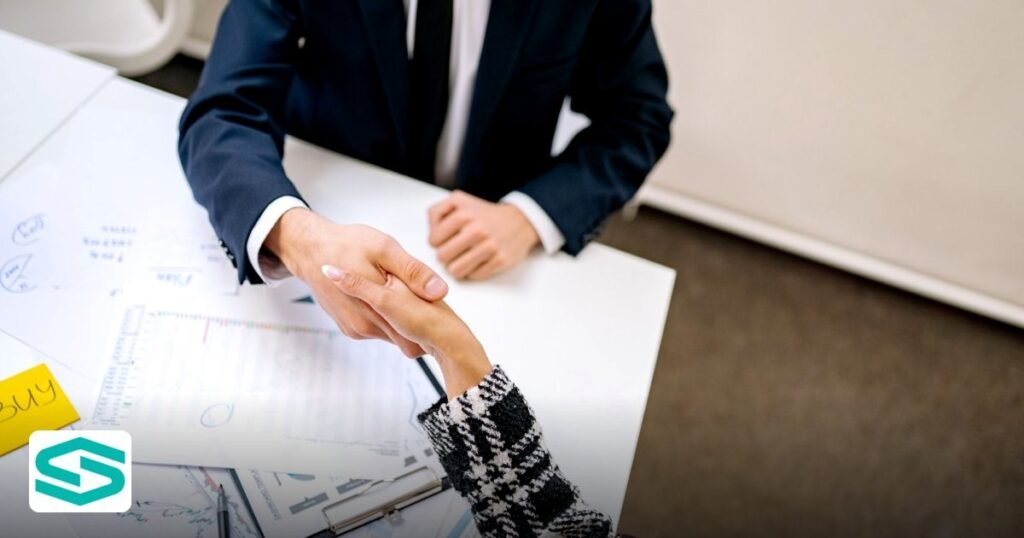 How to Secure a UAE E‑Commerce License in 2026 – Step‑by‑Step Guide - two professionals formalizing a business agreement