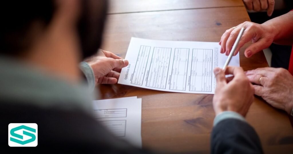 UBO Declaration UAE Free Zone: 2026 Filing Guide - close-up of business professionals reviewing documents at a meeting