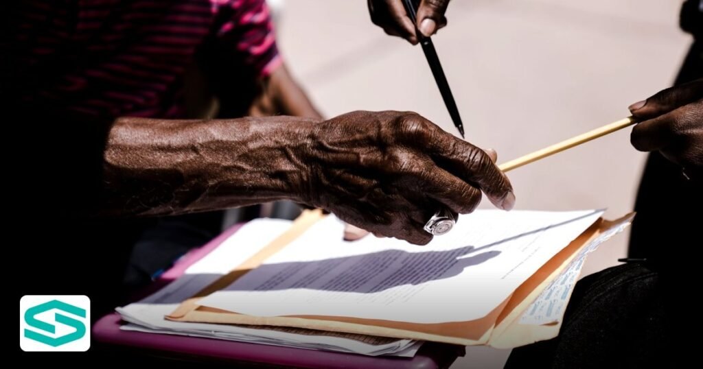 Documents Needed to Register a Free Zone Company UAE - close-up of hands exchanging documents with pens outdoors