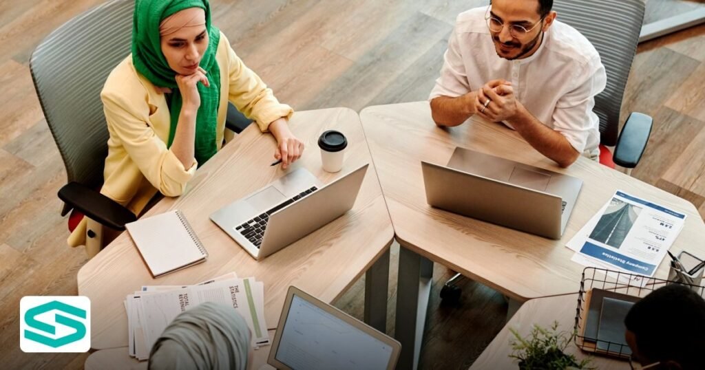UAE Free Zone Green Energy Incentives: A 2026 Startup Guide - top view of a diverse team engaged in a discussion
